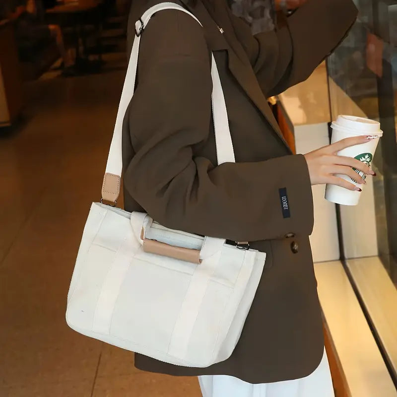 ベージュキャンバスハンドバッグ、複数のポケット、耐久性のあるハンドル、そして腕ストラップ - クロージャーなしのデザイン、無地、ナイロン裏地で、カジュアルな使用、旅行用ハンドバッグ|スリーキーハンドルバッグ|ナイロン裏地のインテリア、腕ストラップ財布